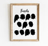 Black silhouettes of an extended family framed on a wall